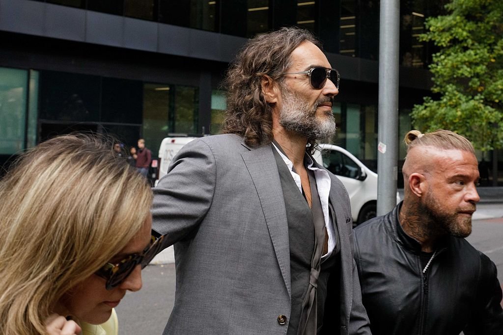 Russell Brand appears in court ahead of rape trial