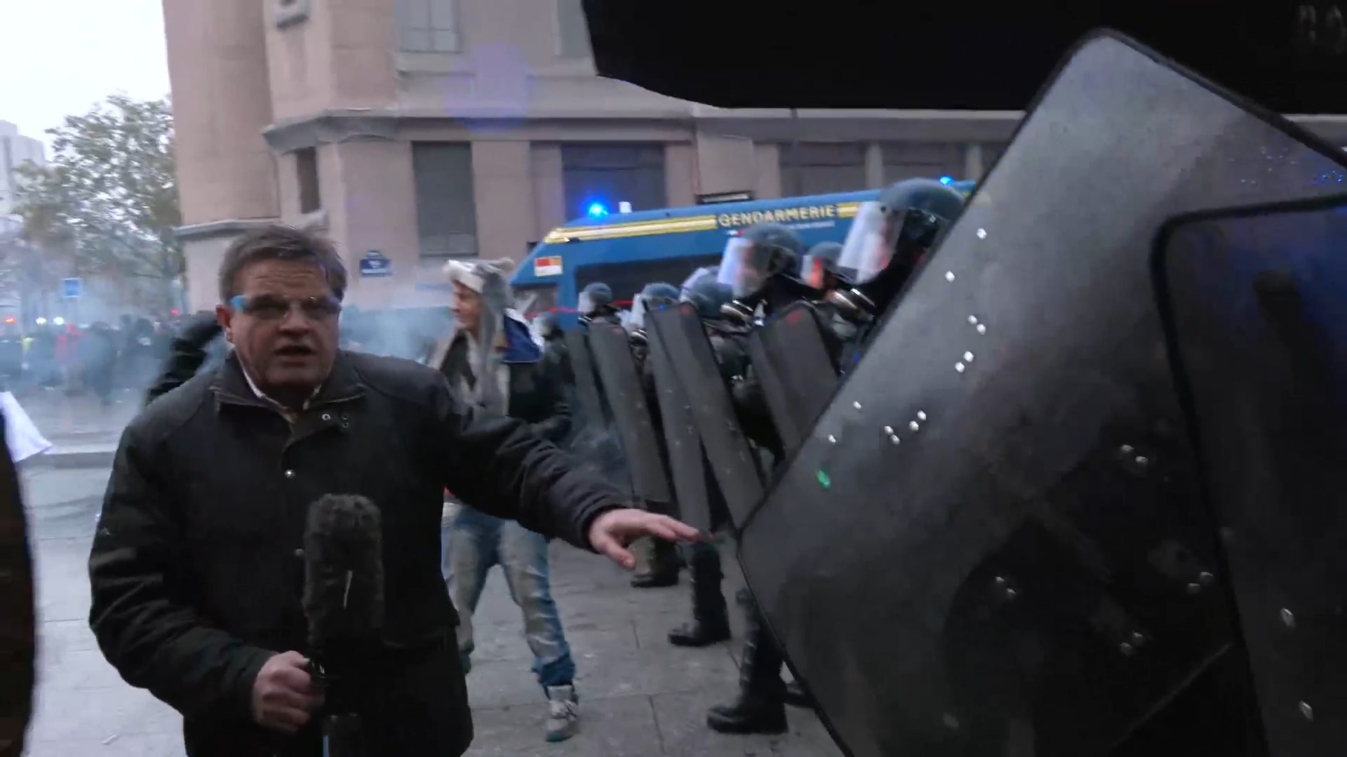 Dougie Beattie dodges tear gas as French rioters clash with police in Paris: ‘I'm being choked!'