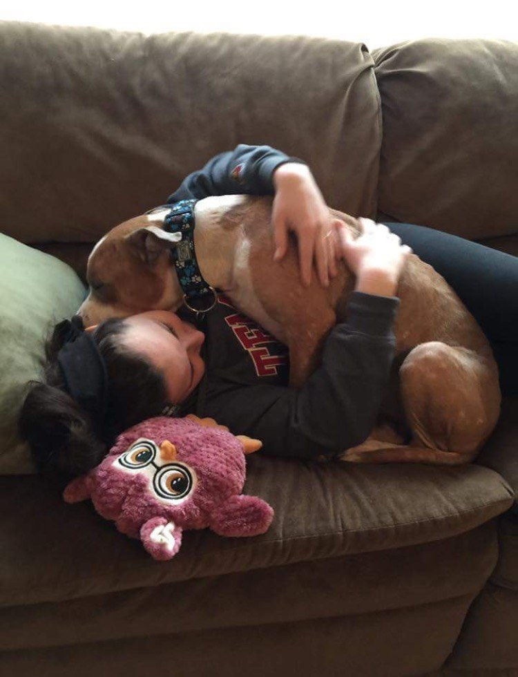 Photo Shows Pit Bull Hugging New Mom After Leaving Shelter
