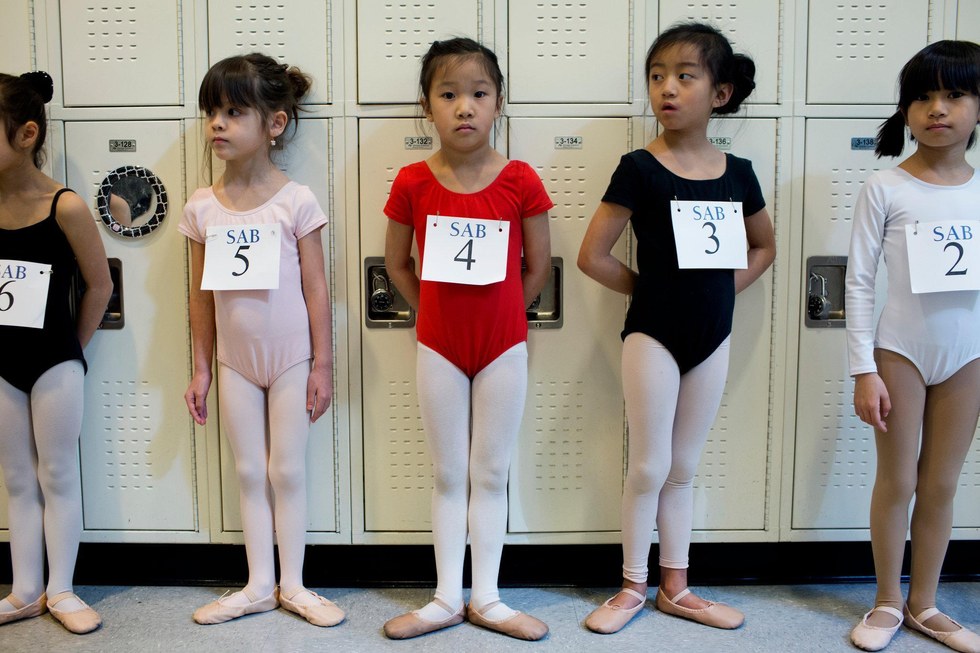 Five young girls wait in line to go auditioning for the School of American  Ballet (SAB), in the New York Borough of Queens, NY, on April 19, 20155.  With no previous dance